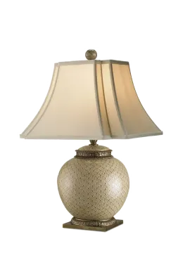 a table lamp with a beige shade