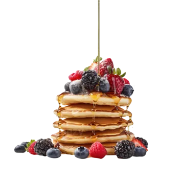 a stack of pancakes with berries and syrup