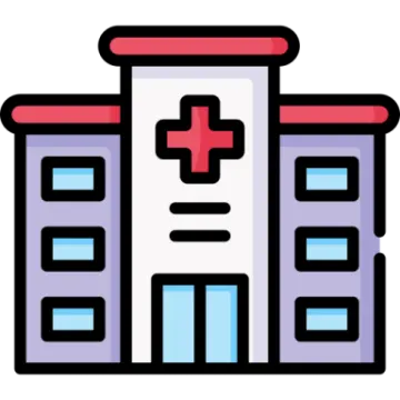 a hospital building with a cross on the front
