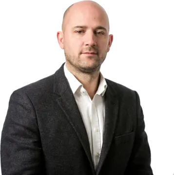 a man in a suit and white shirt