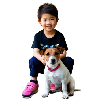 a small dog sitting next to a little boy