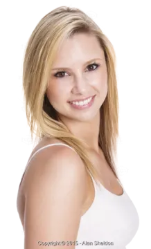a woman with blonde hair and a white tank top