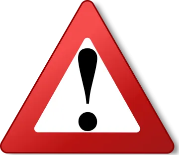 a red and white triangular sign with a question mark on it