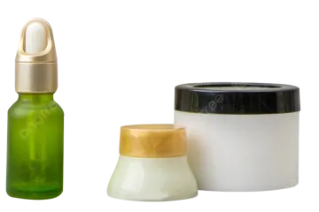 a bottle of green liquid next to a container of white liquid