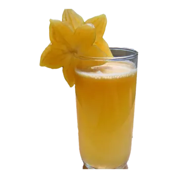 a glass of orange juice with a flower on top