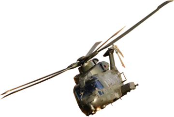 a military helicopter flying through the air