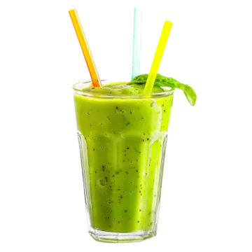 a glass filled with green smoothie and two straws