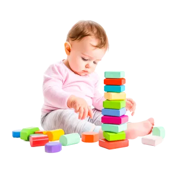 a baby playing with wooden blocks