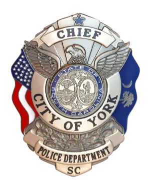 a police badge with an american flag in the background
