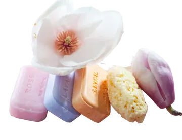 a bunch of soaps sitting on top of a wooden board