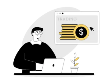 a man sitting in front of a laptop with the word trading on it