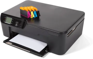 a printer is sitting on top of a white surface