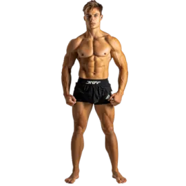 a man with no shirt standing in front of the camera