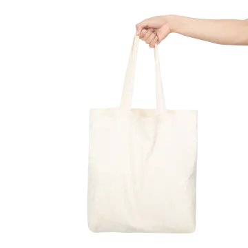 a person holding a white tote bag