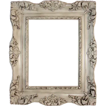 a white picture frame with an ornate design