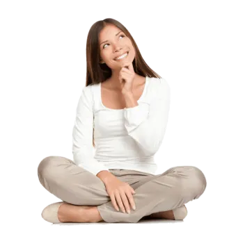 a woman sitting on the floor with her hand to her mouth