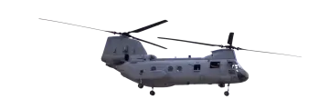 a military helicopter flying in the sky