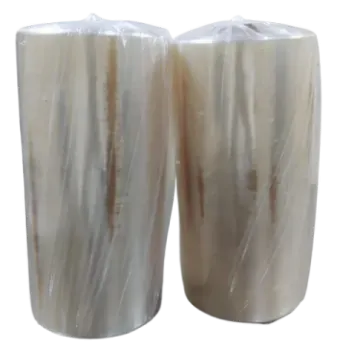 a pair of white marble candles on a white background