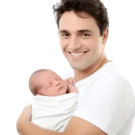 a man holding a baby in his arms