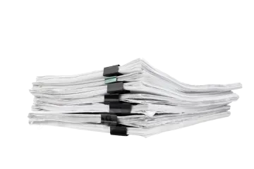a stack of newspapers on a white background