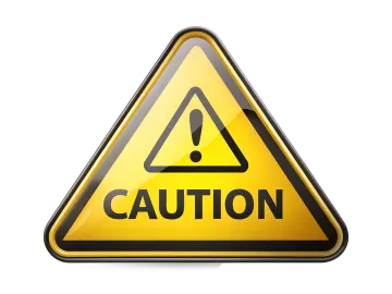 a caution sign on a white background