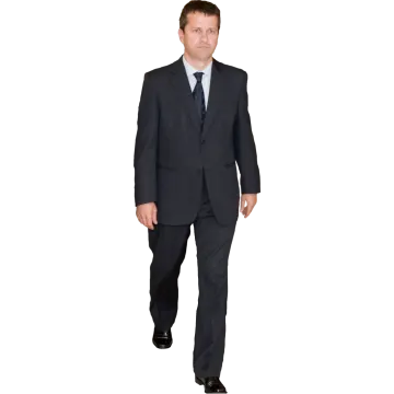 a man in a suit and tie walking