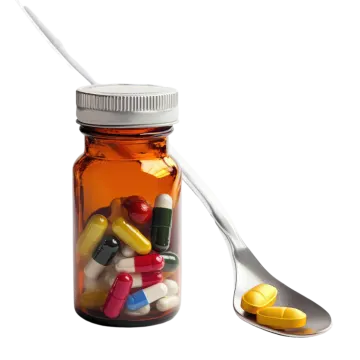 a spoon full of pills