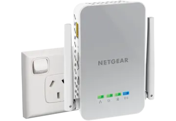 a white netge wireless device next to an outlet