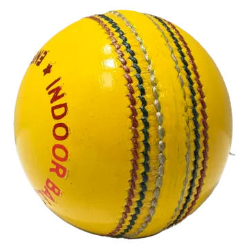 a yellow cricket ball with red writing on it