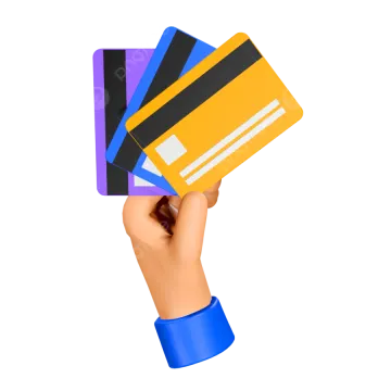 a hand holding three credit cards