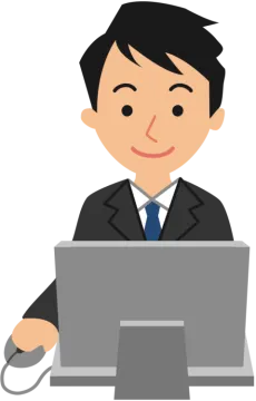a man in a suit working on a laptop