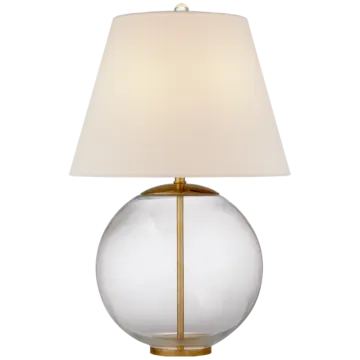 a glass table lamp with a white shade