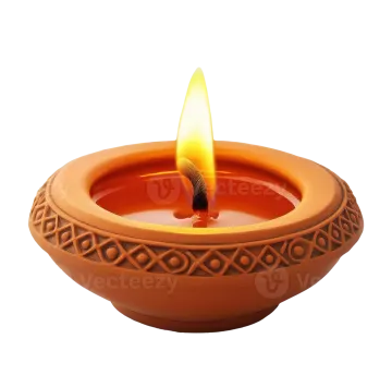 a clay oil lamp with a flame
