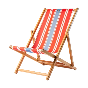 a red, white and blue striped deck chair