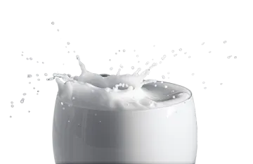 a glass filled with milk on a white background