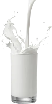 a glass of milk being poured into it