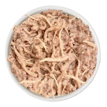 a white bowl filled with cooked chicken