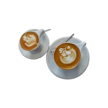 two cups of coffee on a saucer