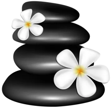 a stack of black stones with white flowers on top