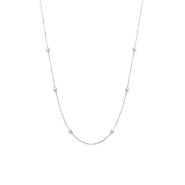 a white gold necklace with three diamonds