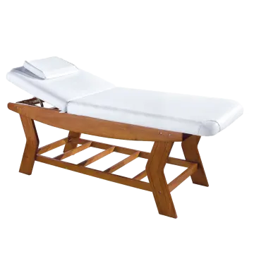 a wooden massage table on a white background