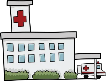 a hospital building with a red cross on the top