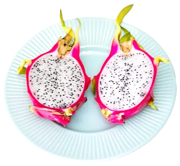 two halves of dragon fruit on a plate