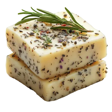 three pieces of soap with herbs on top