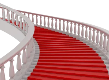 a staircase with red carpet and white railing