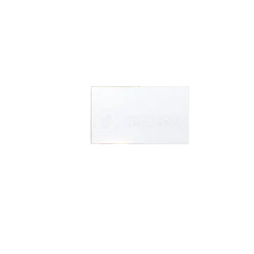 a hand holding a white business card