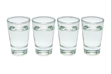 four shot glasses on a white background