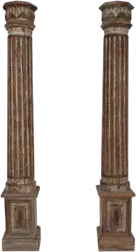 a pair of carved wooden columns