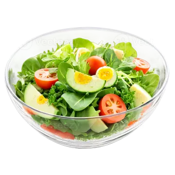 a salad in a glass bowl on a white background