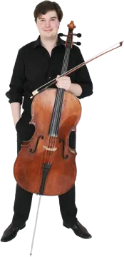 a young man in black shirt holding a cello